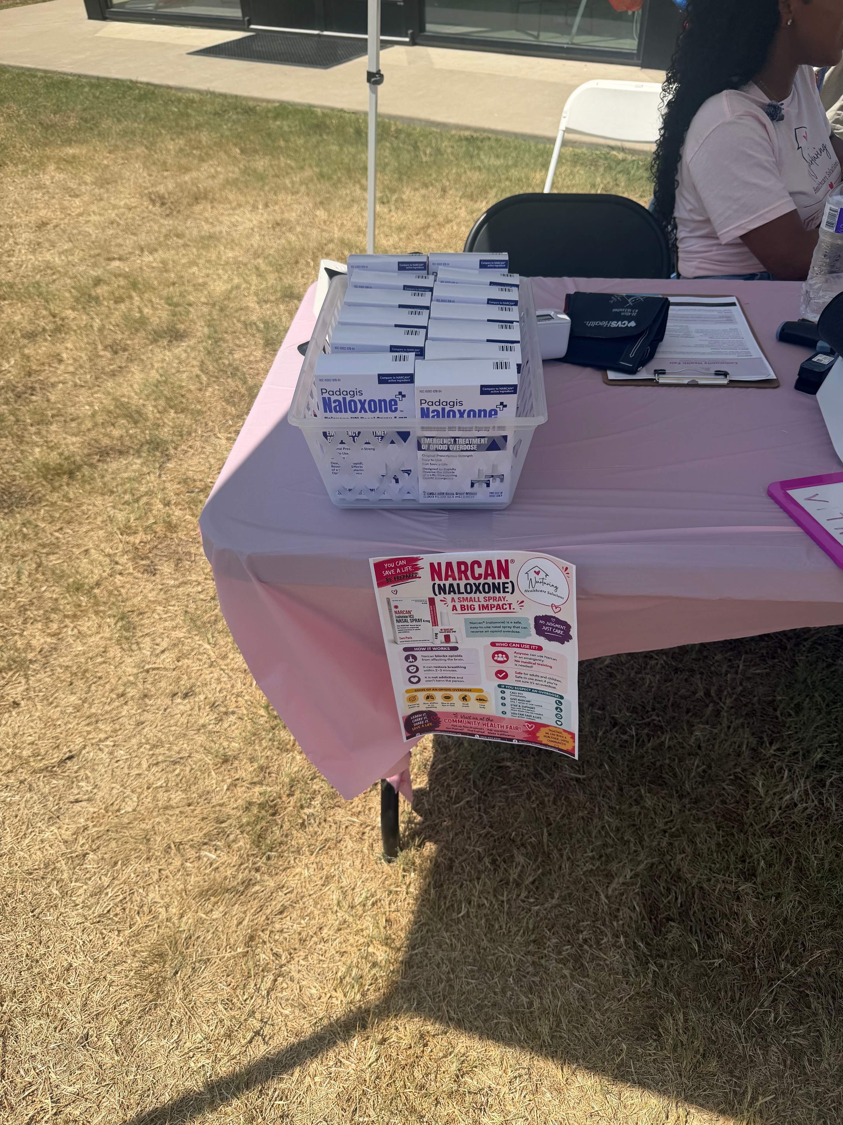 Narcan/Naloxone distribution table at health fair