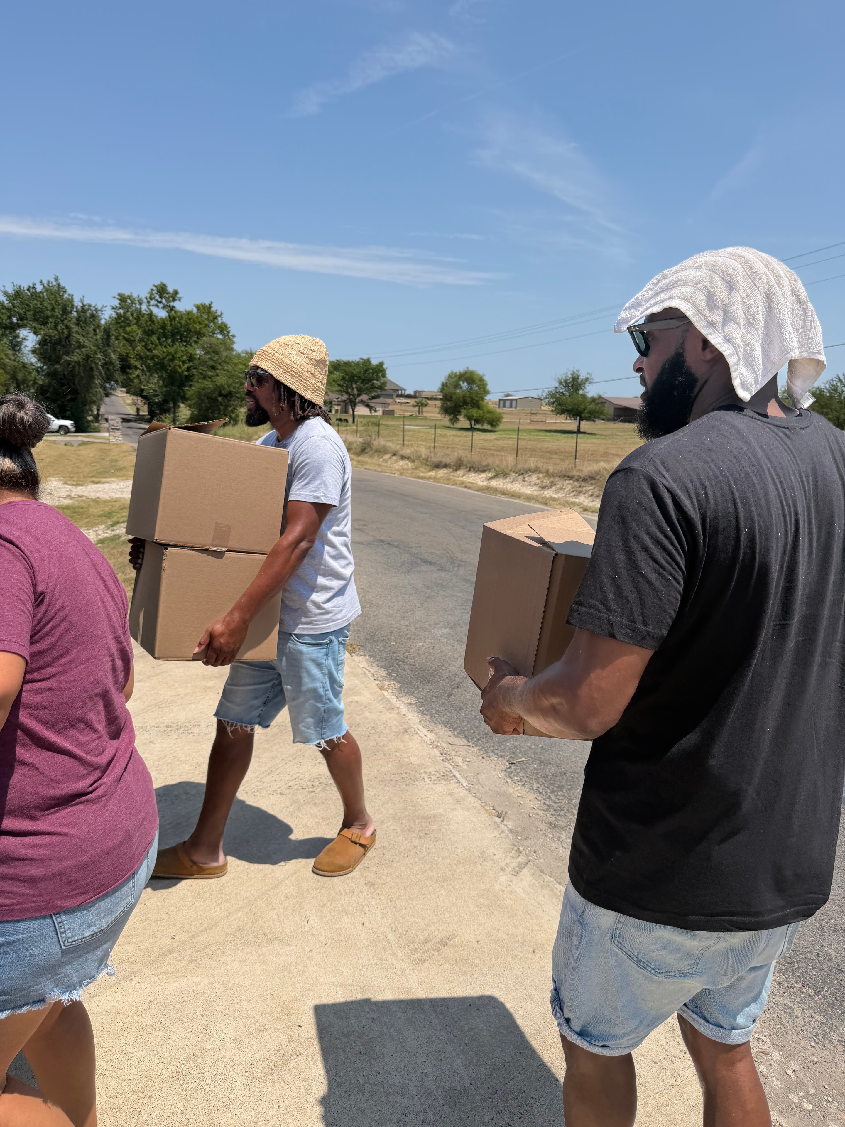 Volunteers distributing boxes at community event