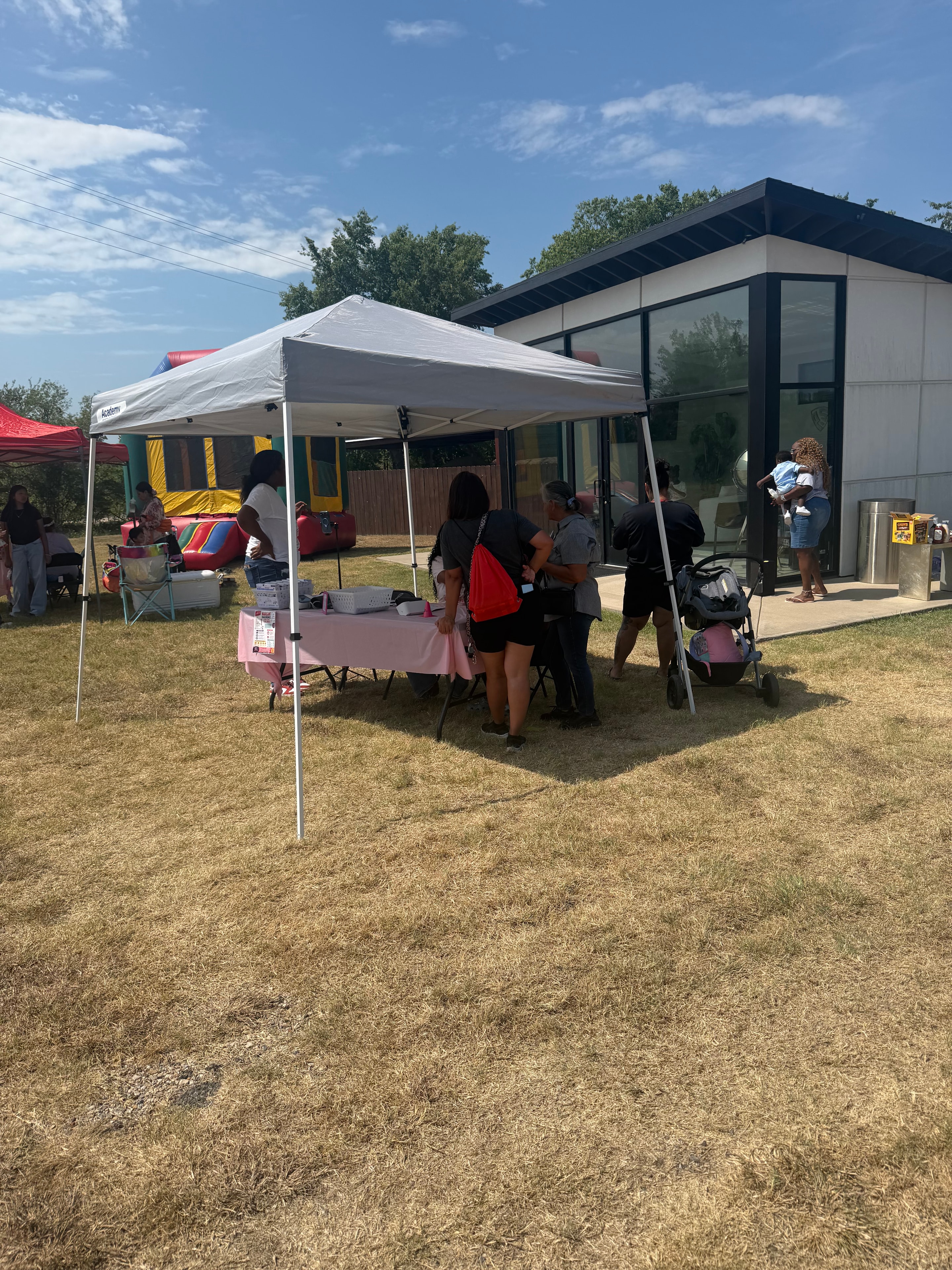 Outdoor community health event at modern building