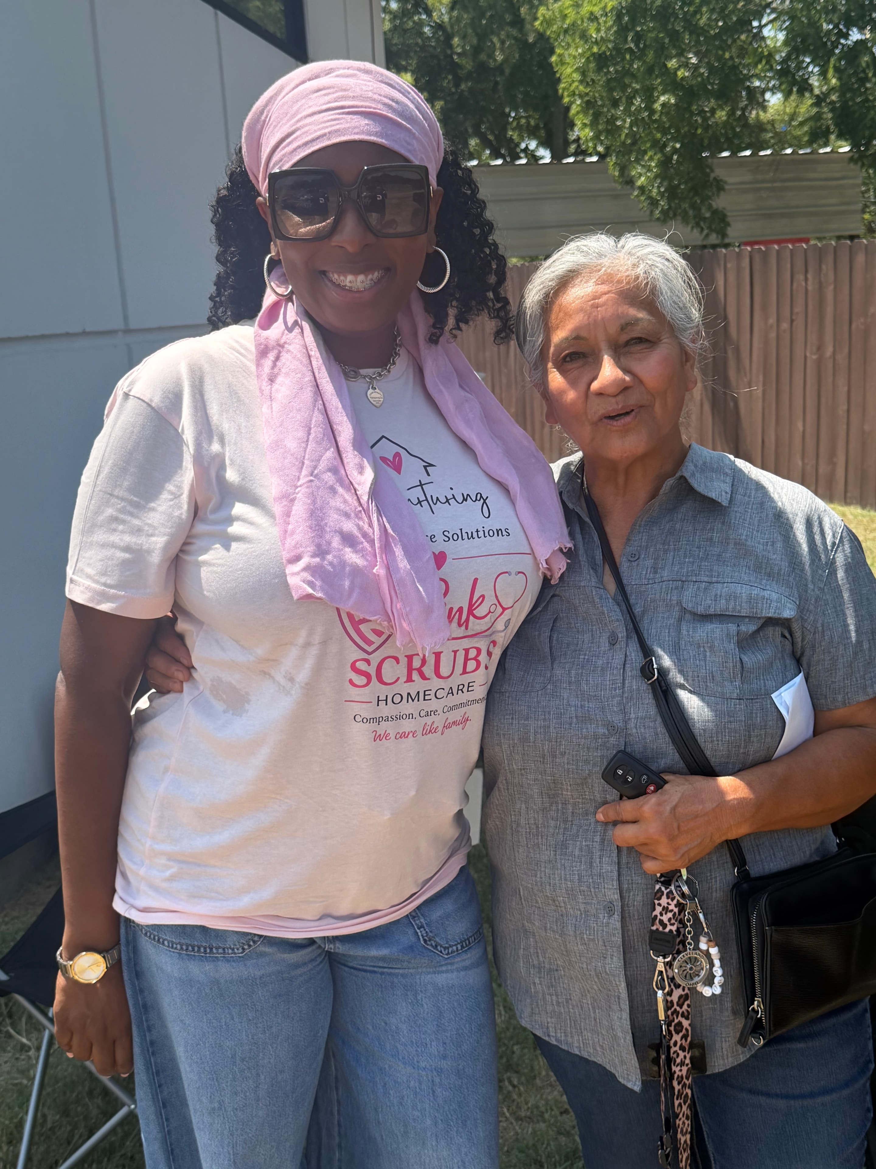 Two community members at outdoor event